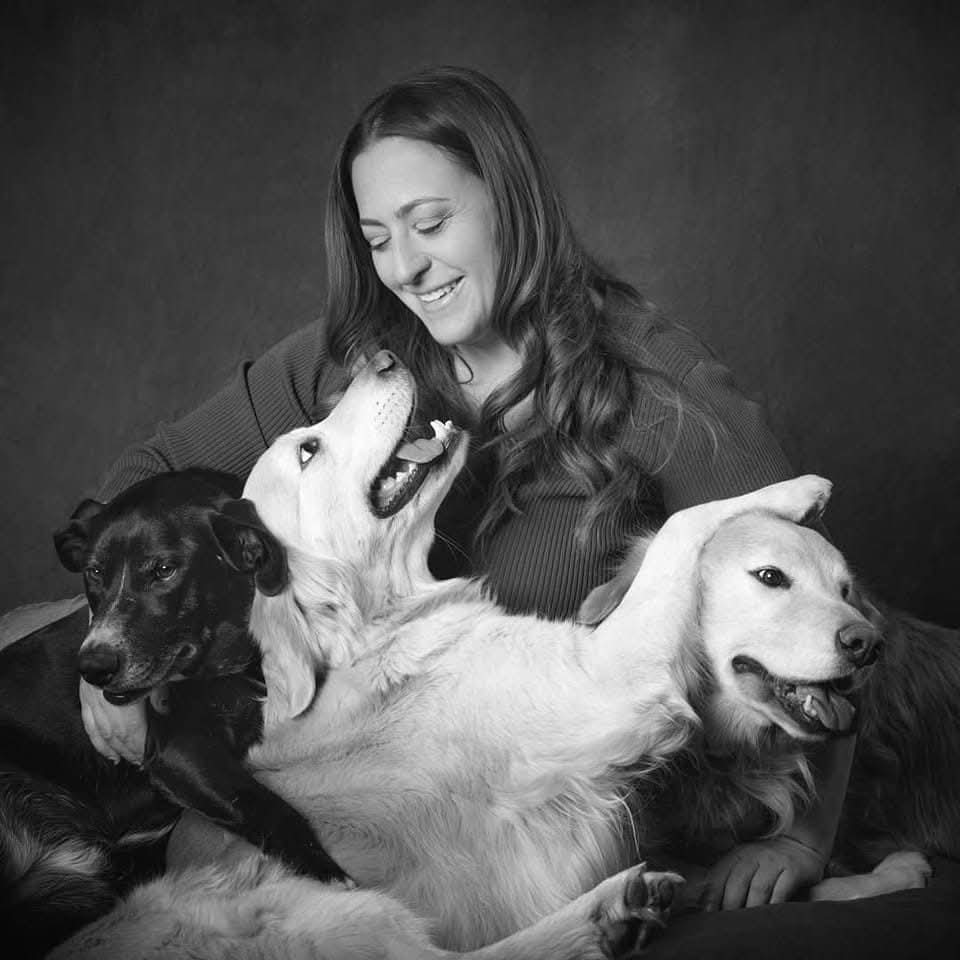 Rachelle Matossian with three dogs.